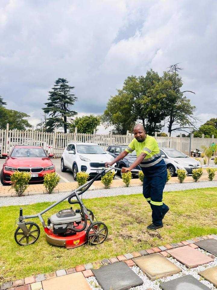 Fresh Lavation team maintaining garden pathway and stone walkway