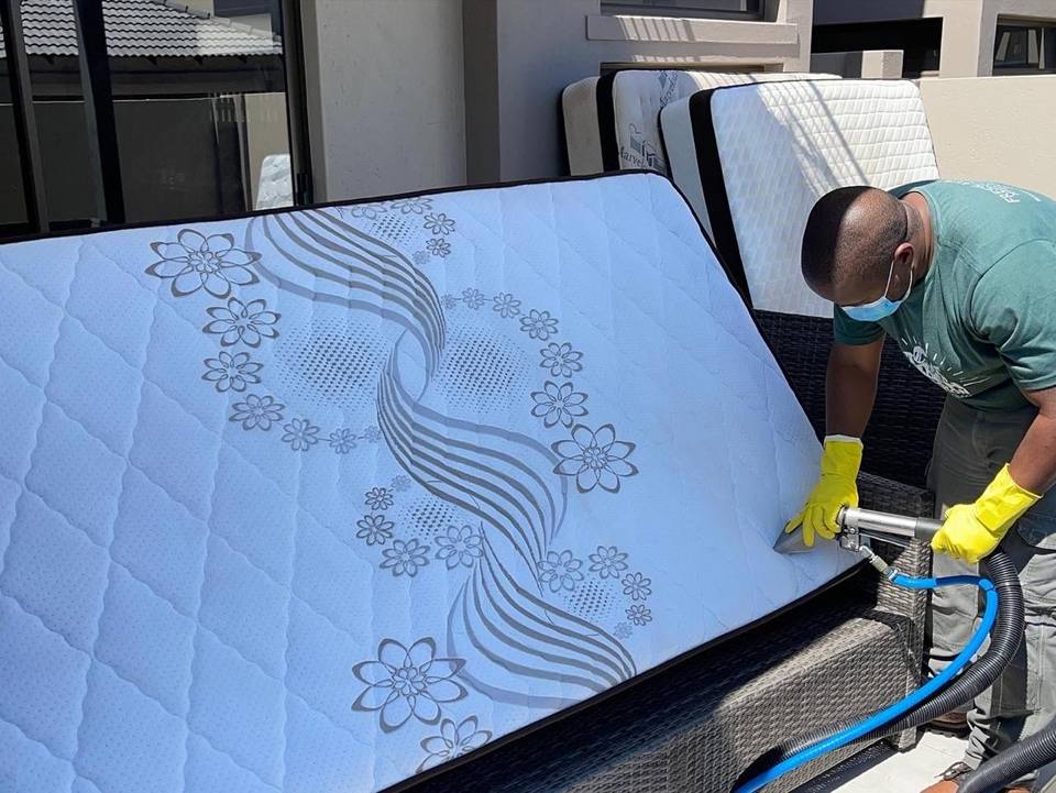 Fresh Lavation technician steam cleaning a mattress in Pretoria