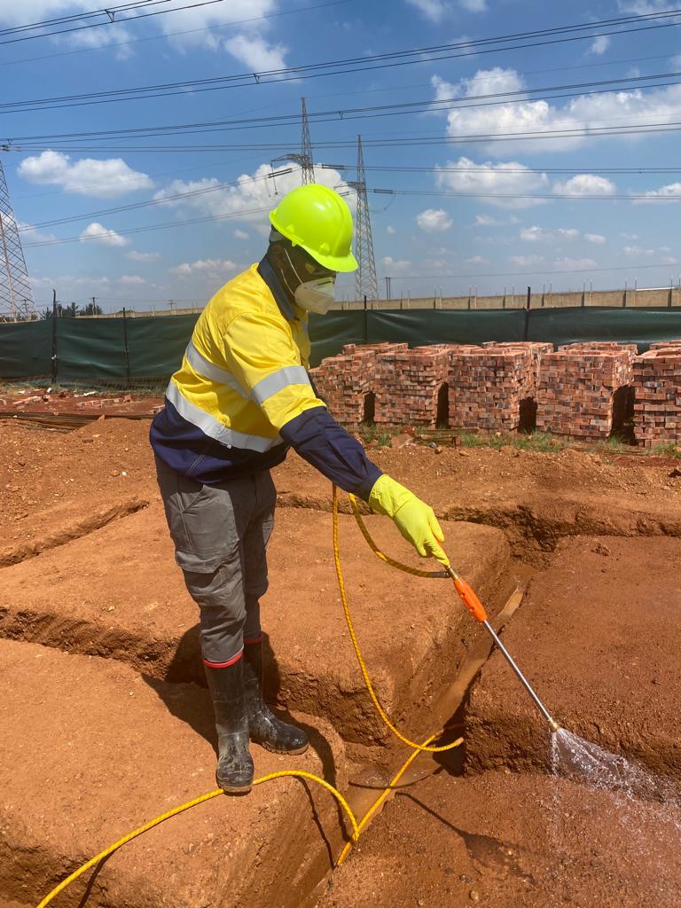 Fresh Lavation technician applying termite control treatment at a construction site in Pretoria